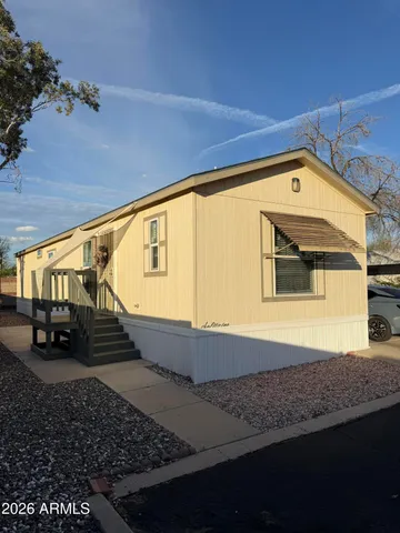a view of a car park in front of a house