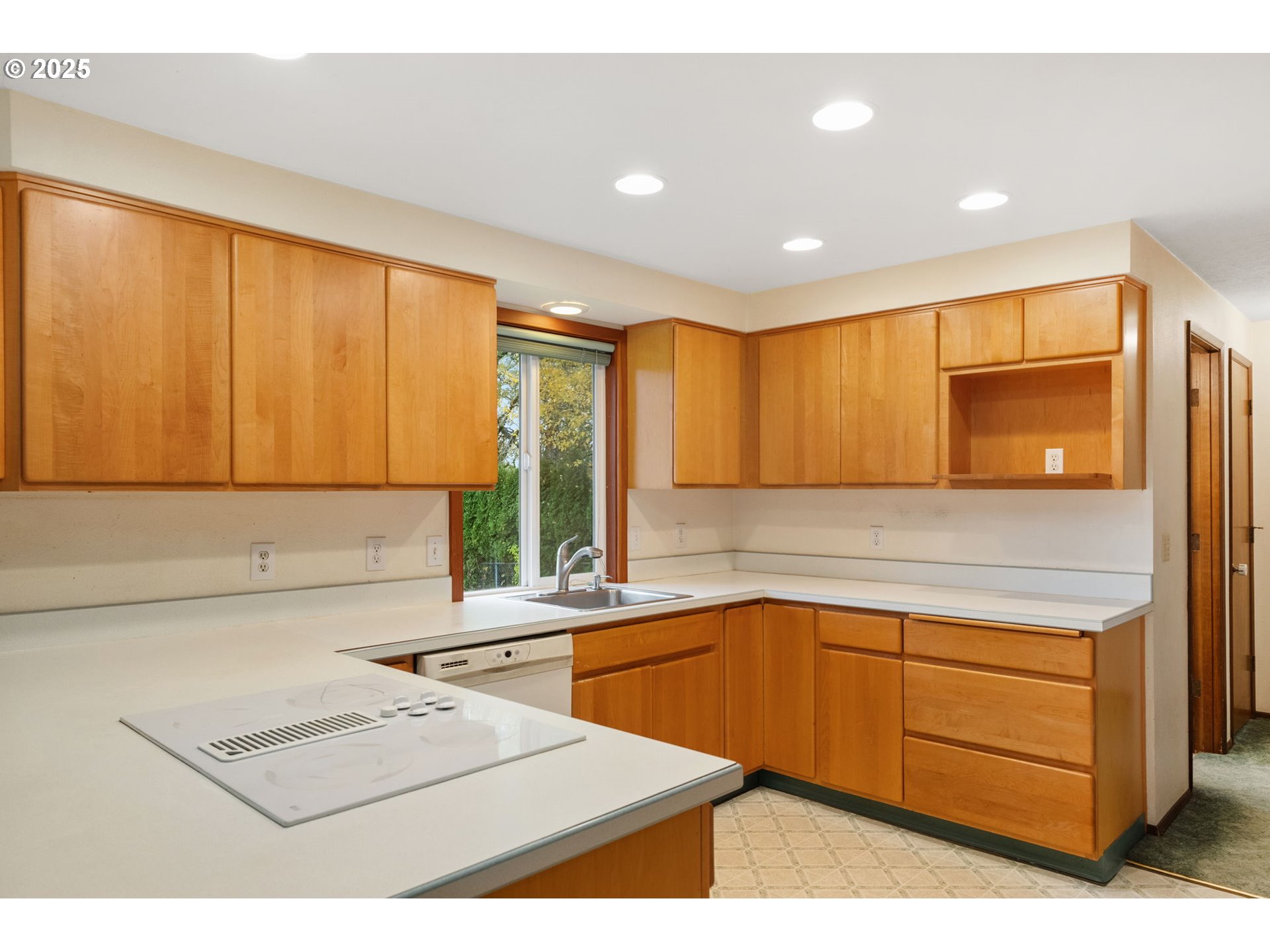 2433 Southeast Barnes Road Gresham, OR 97080 - Photo 11 of 27 a kitchen with a sink a stove cabinets and a counter top space