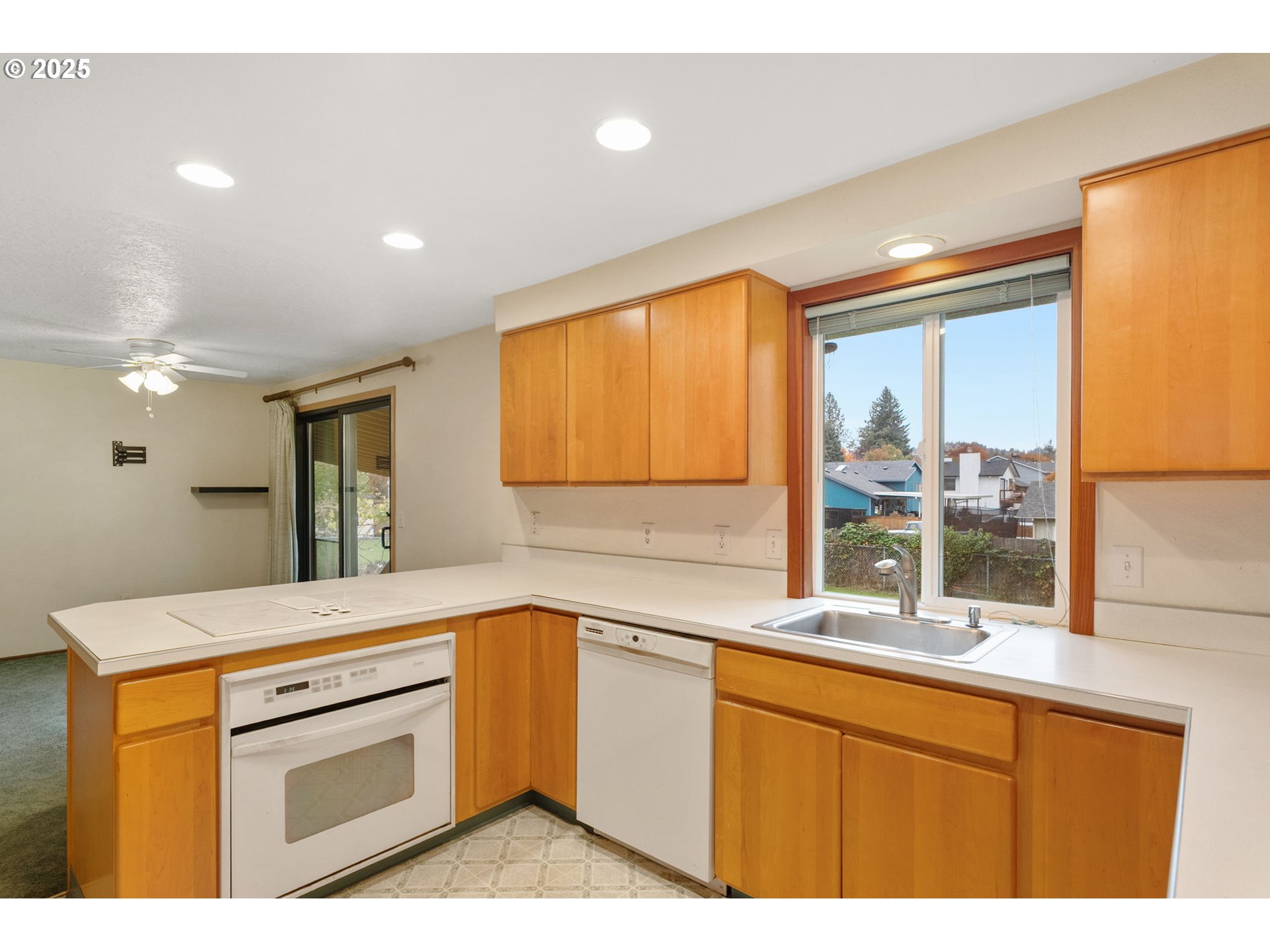 2433 Southeast Barnes Road Gresham, OR 97080 - Photo 14 of 27 a kitchen with granite countertop a sink stainless steel appliances and cabinets