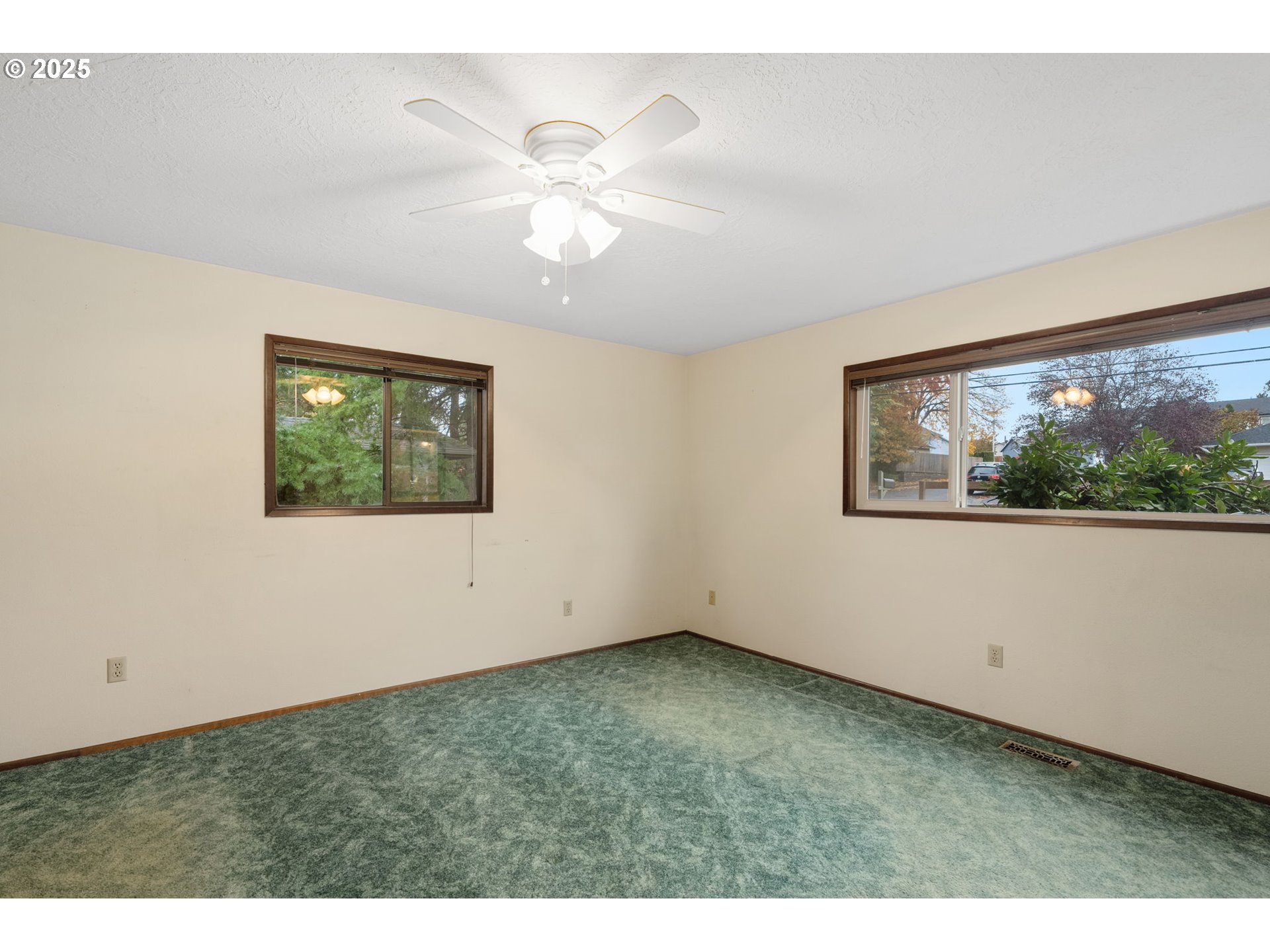 2433 Southeast Barnes Road Gresham, OR 97080 - Photo 17 of 27 a view of an empty room with a window