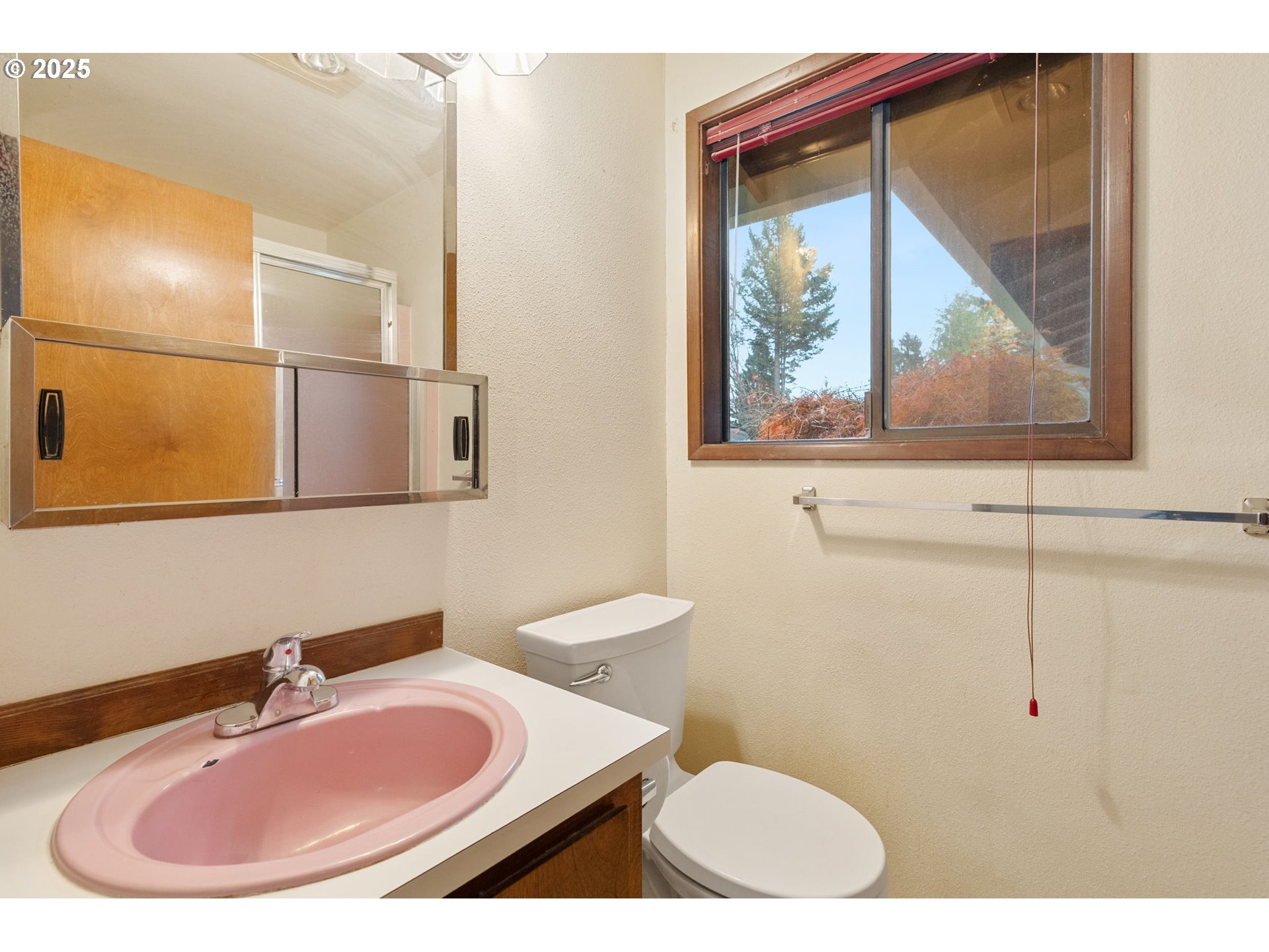 2433 Southeast Barnes Road Gresham, OR 97080 - Photo 18 of 27 a bathroom with a sink and a mirror