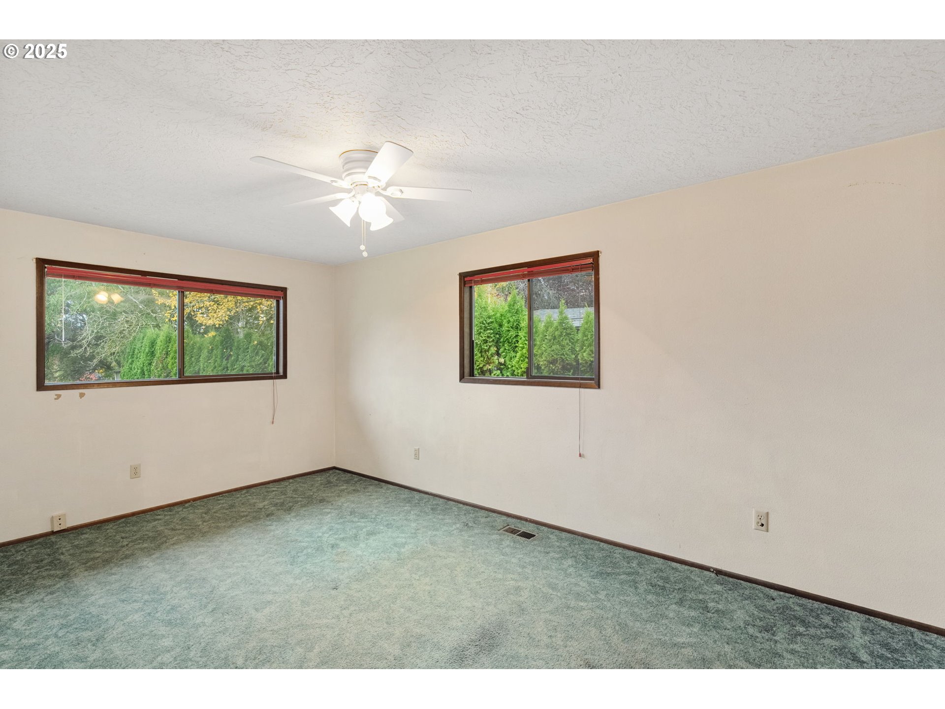 2433 Southeast Barnes Road Gresham, OR 97080 - Photo 20 of 27 an empty room with fan and windows