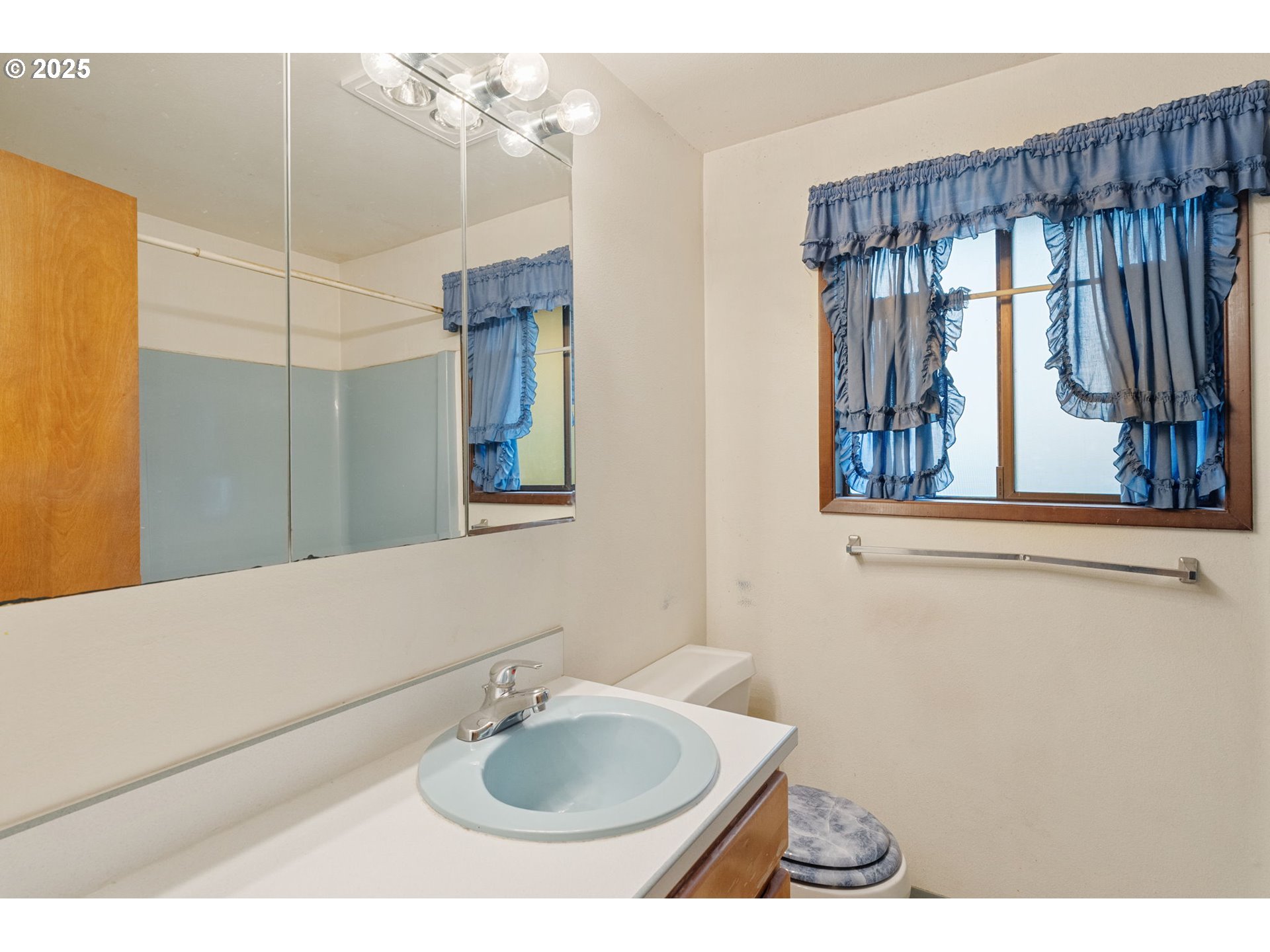 2433 Southeast Barnes Road Gresham, OR 97080 - Photo 21 of 27 a bathroom with a sink and a mirror