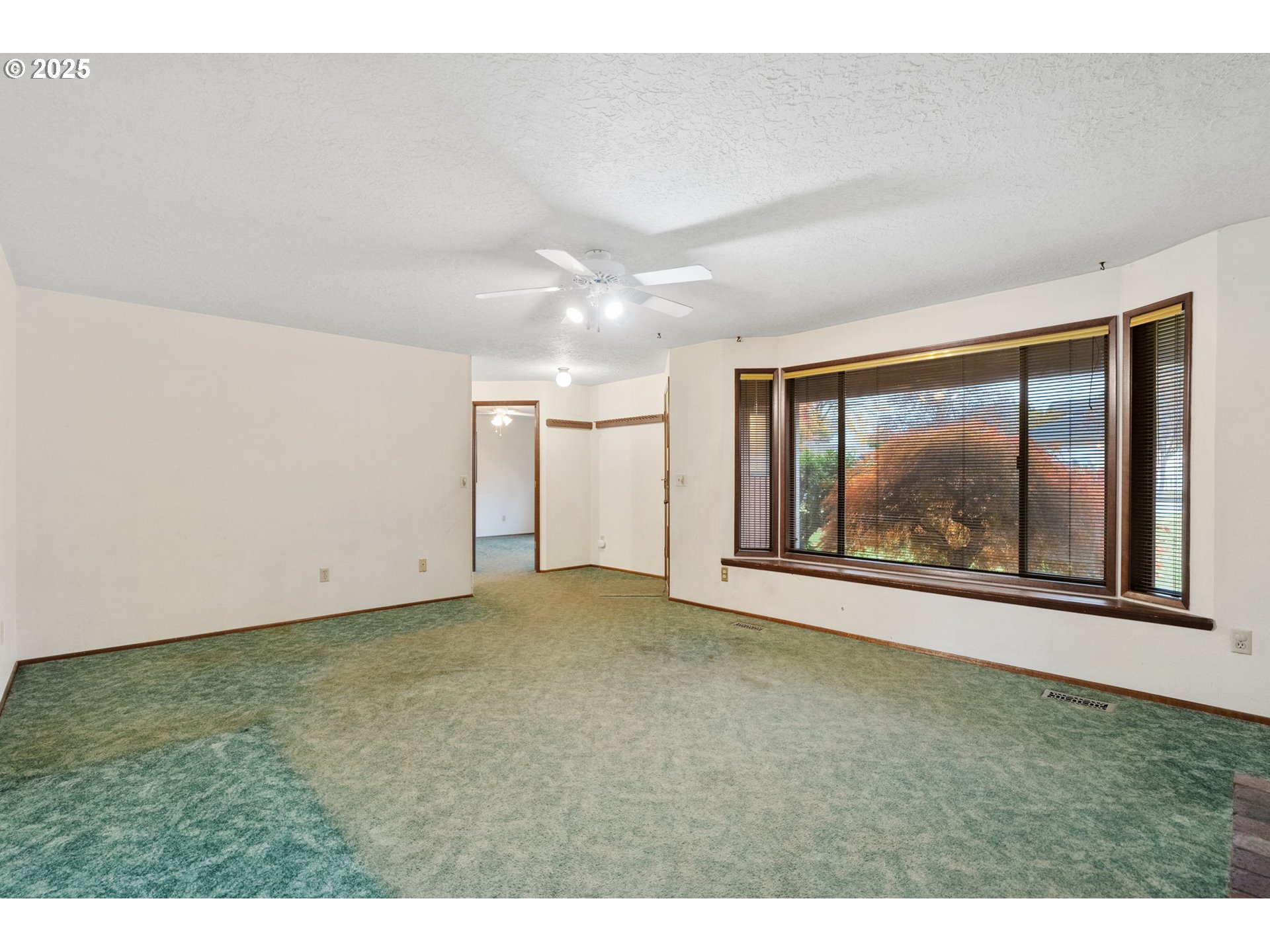 2433 Southeast Barnes Road Gresham, OR 97080 - Photo 6 of 27 a view of an empty room with a window