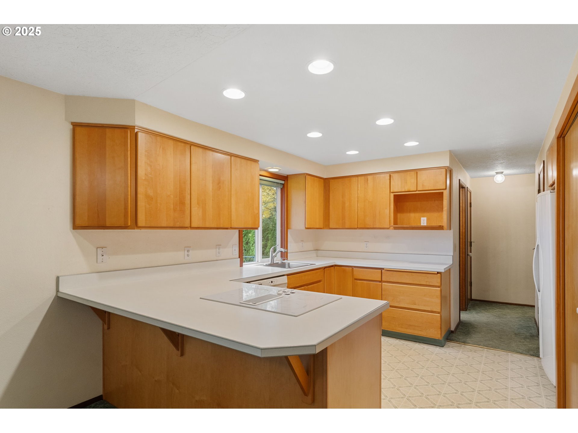 2433 Southeast Barnes Road Gresham, OR 97080 - Photo 10 of 27 a kitchen with a sink cabinets and window