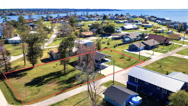 an aerial view of residential houses and outdoor space