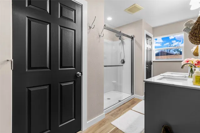 a bathroom with a sink and mirror