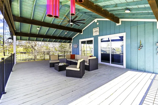 a outdoor living space with furniture and a large window