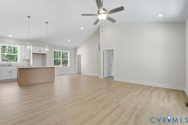 a view of a kitchen with a sink and a refrigerator