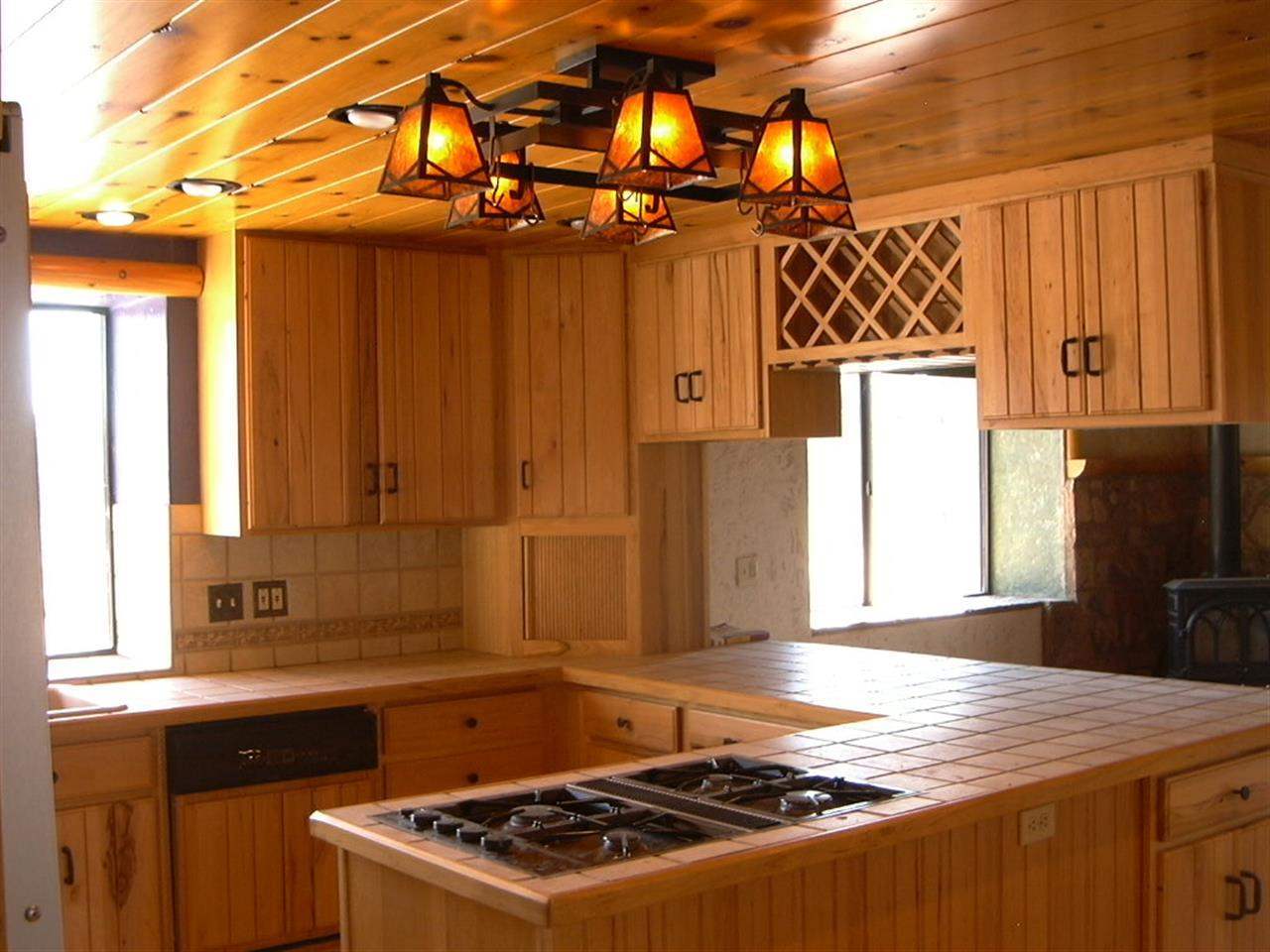 5366 Longhorn Road Snowflake, AZ 85937 - Photo 8 of 29 a kitchen with a stove a sink and a refrigerator