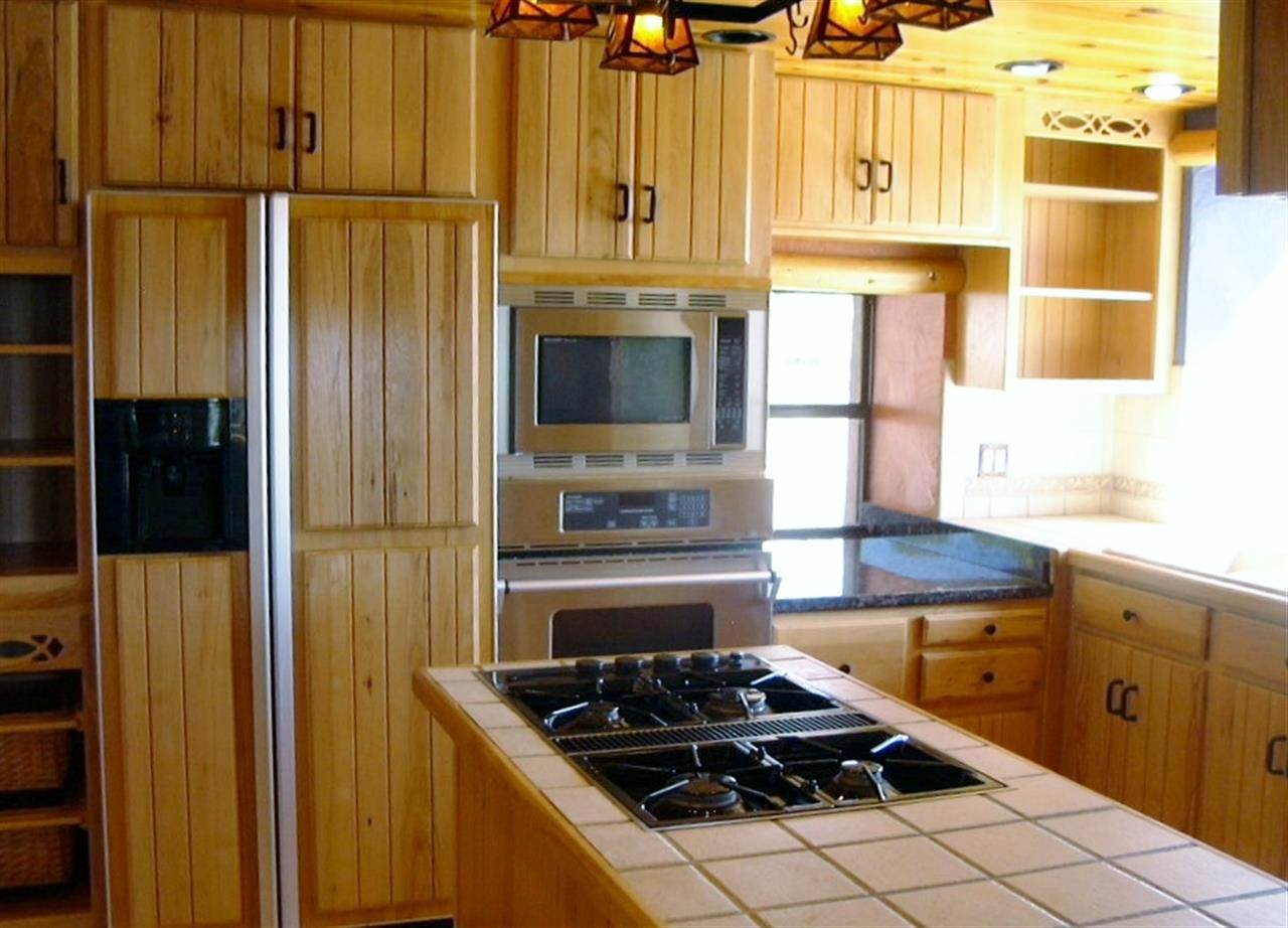 5366 Longhorn Road Snowflake, AZ 85937 - Photo 9 of 29 a kitchen with stainless steel appliances a stove a refrigerator and cabinets