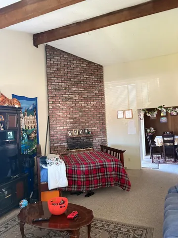 a bedroom with furniture and a chair