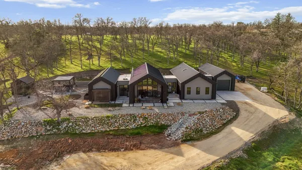 a view of a town with mountains in the background