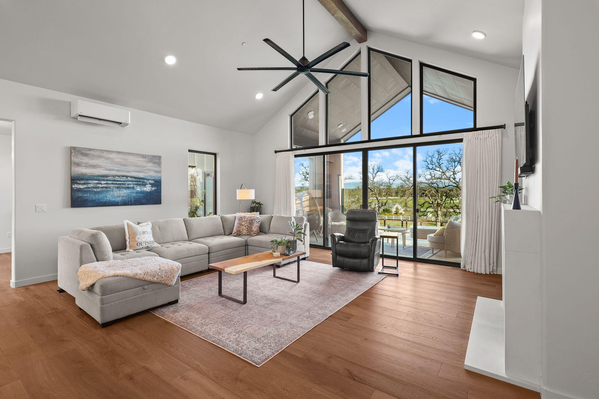 8202 Maynard Road Palo Cedro, CA 96073 - Photo 11 of 74 a living room with furniture large window and wooden floor