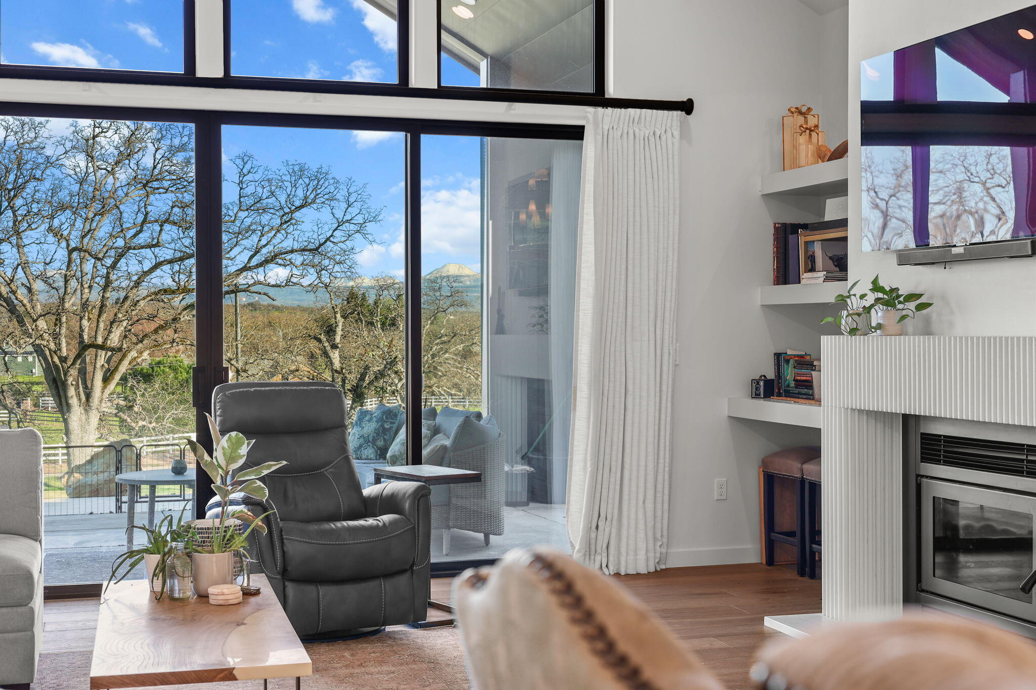 8202 Maynard Road Palo Cedro, CA 96073 - Photo 14 of 74 a living room with furniture and a fireplace