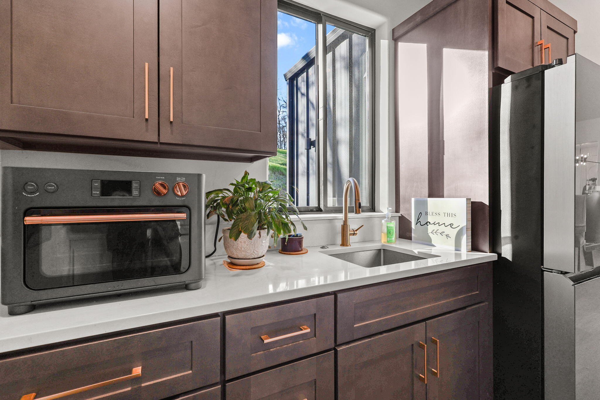 8202 Maynard Road Palo Cedro, CA 96073 - Photo 22 of 74 a kitchen with stainless steel appliances granite countertop a sink a stove and a microwave