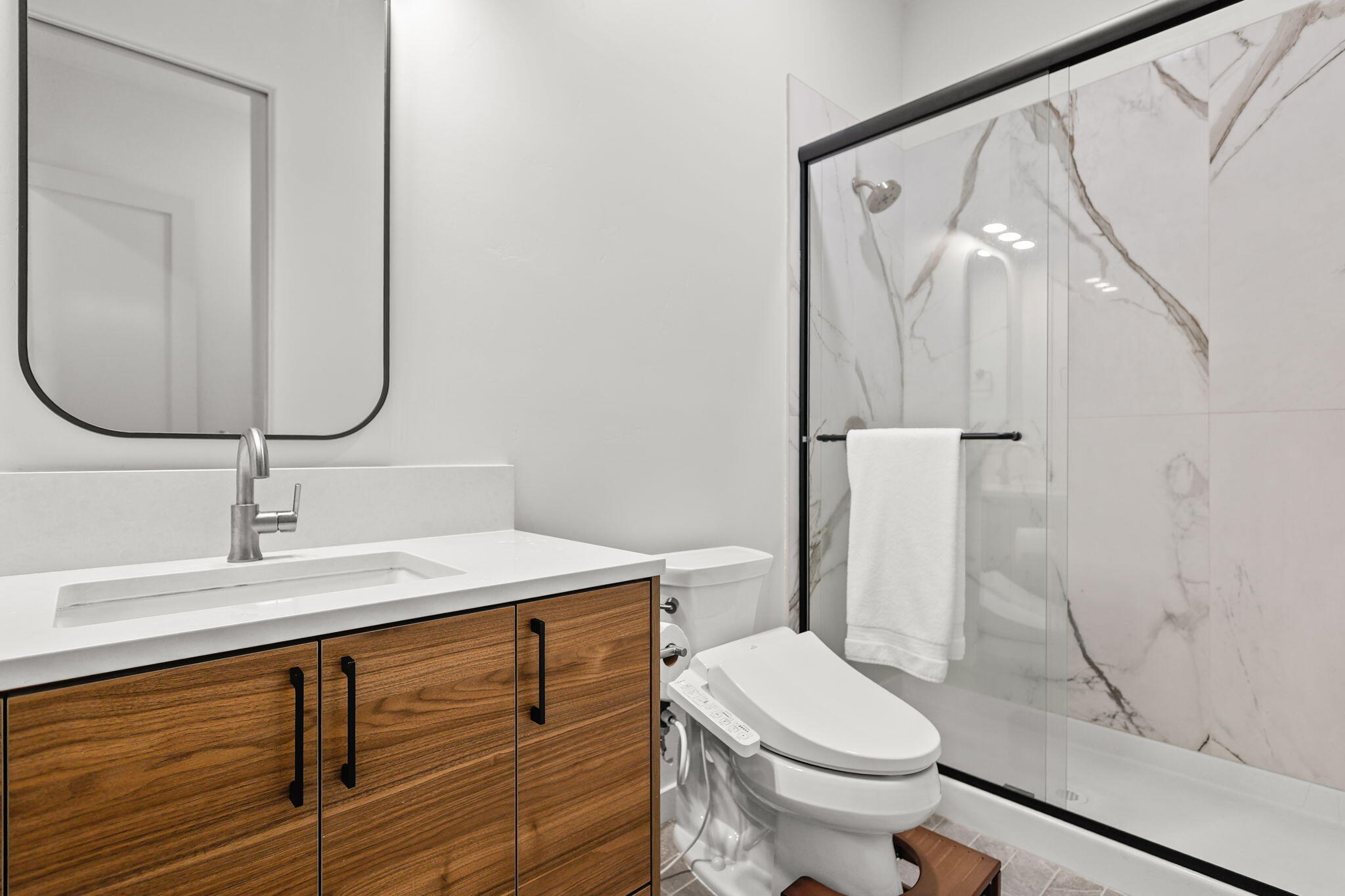 8202 Maynard Road Palo Cedro, CA 96073 - Photo 42 of 74 a bathroom with a sink a toilet and shower