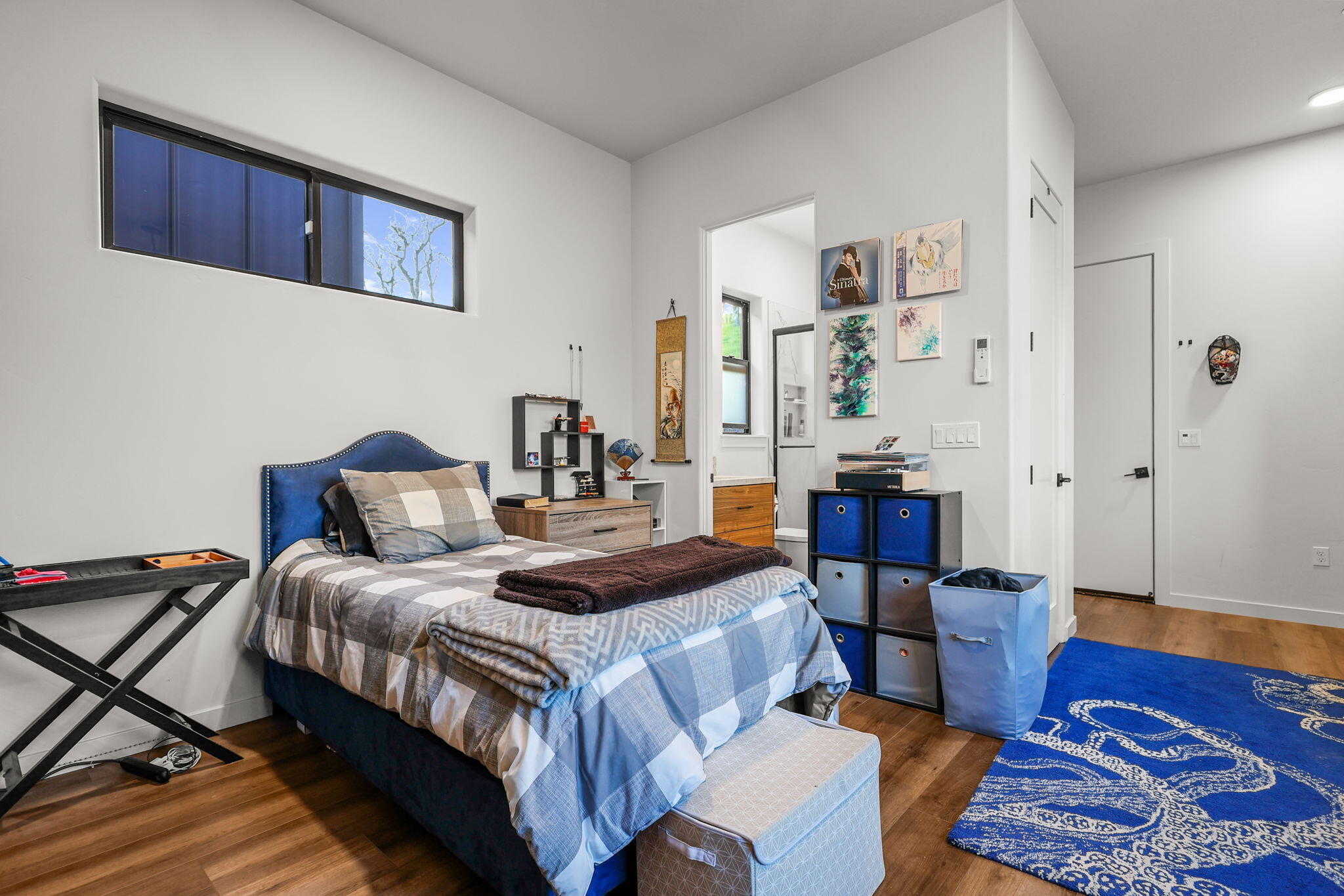 8202 Maynard Road Palo Cedro, CA 96073 - Photo 58 of 74 a bedroom with a bed and wooden floor