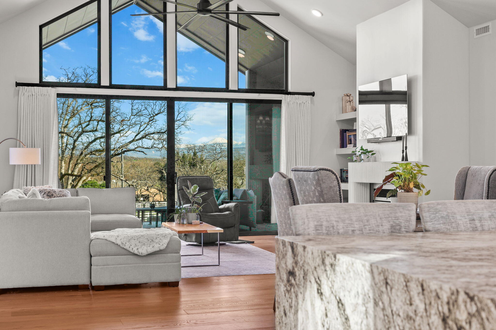 8202 Maynard Road Palo Cedro, CA 96073 - Photo 7 of 74 a living room with furniture and floor to ceiling windows