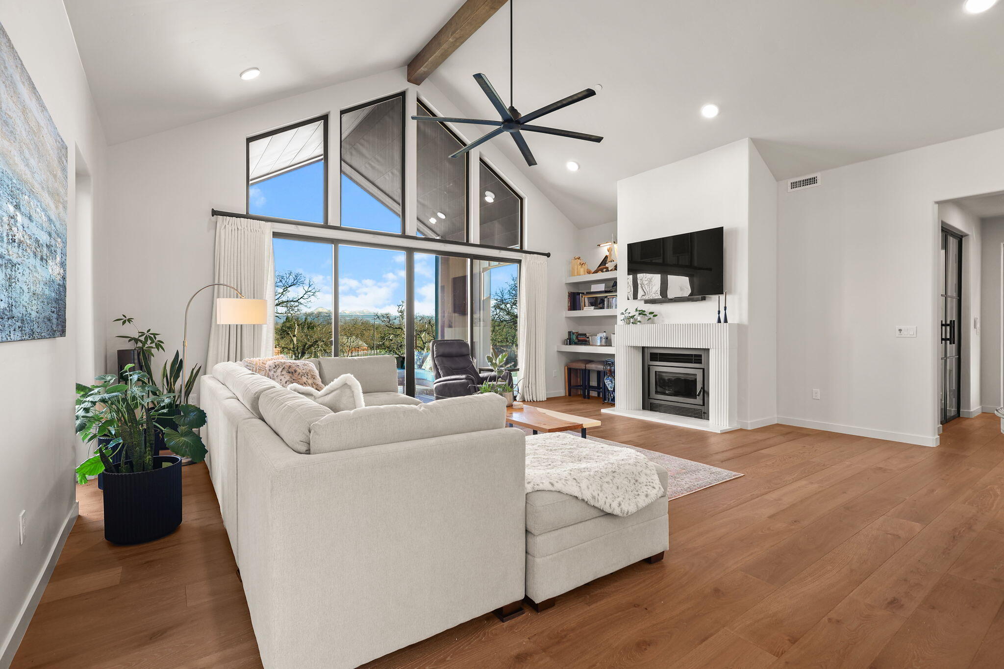 8202 Maynard Road Palo Cedro, CA 96073 - Photo 8 of 74 a living room with furniture fireplace and flat screen tv