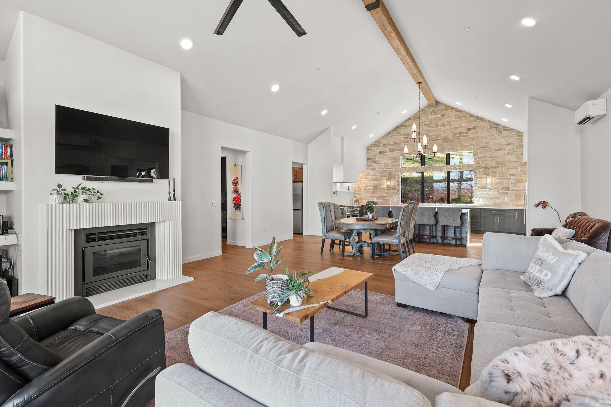 8202 Maynard Road Palo Cedro, CA 96073 - Photo 9 of 74 a living room with furniture fireplace and a flat screen tv