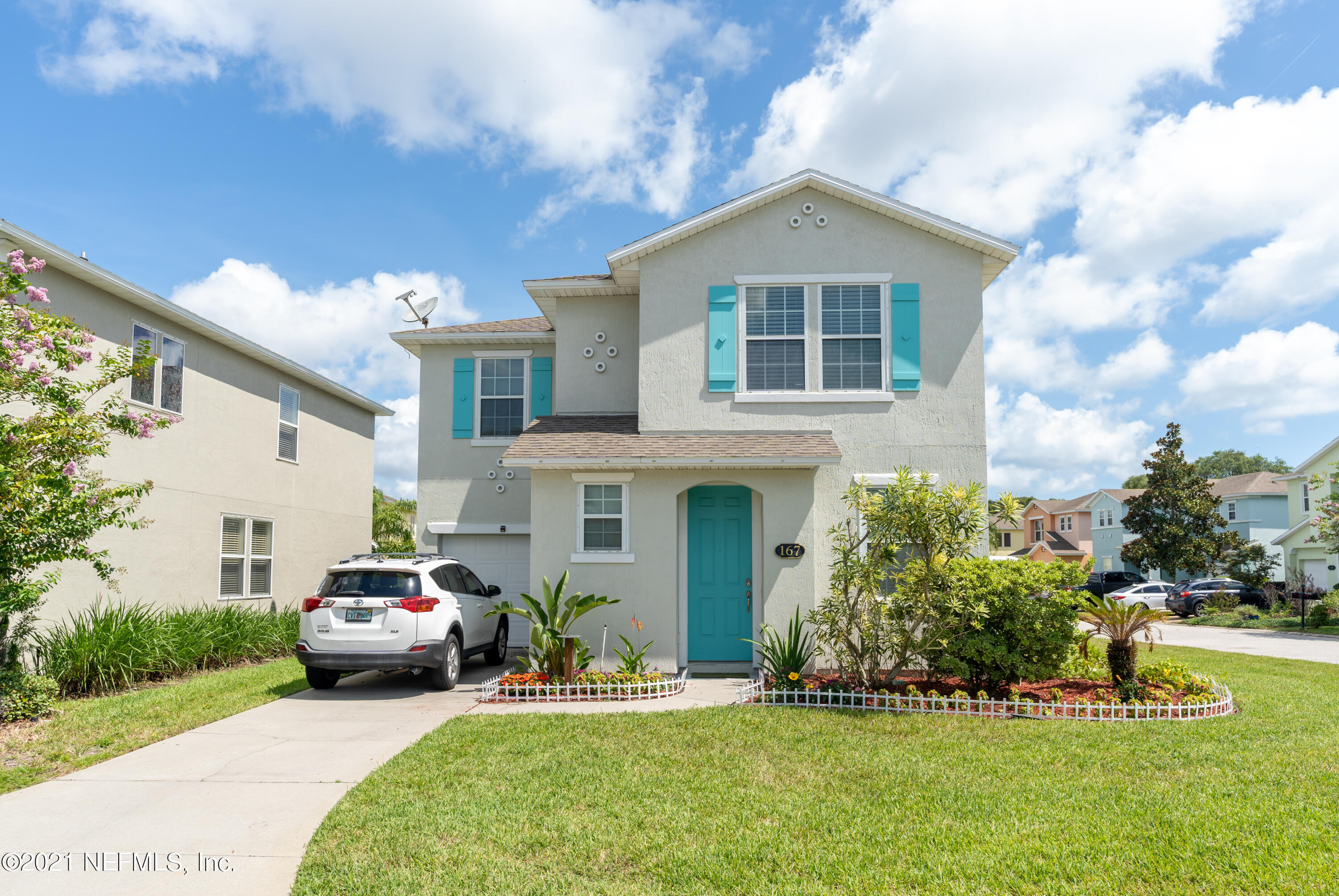 a front view of a house with a yard