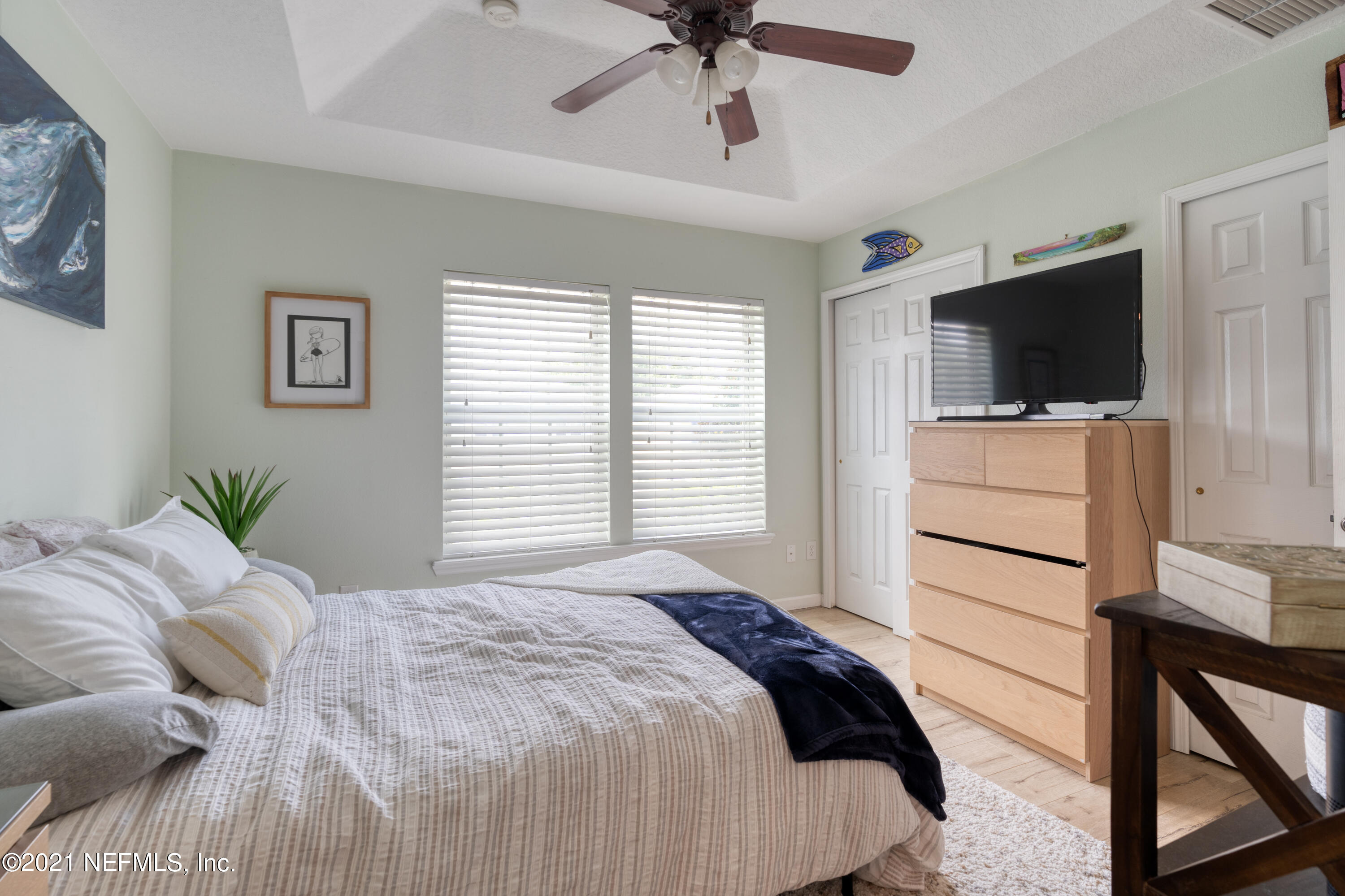 167 Bay Bridge Drive St. Augustine, FL 32080 - Photo 14 of 32 a bedroom with a bed and a flat screen tv