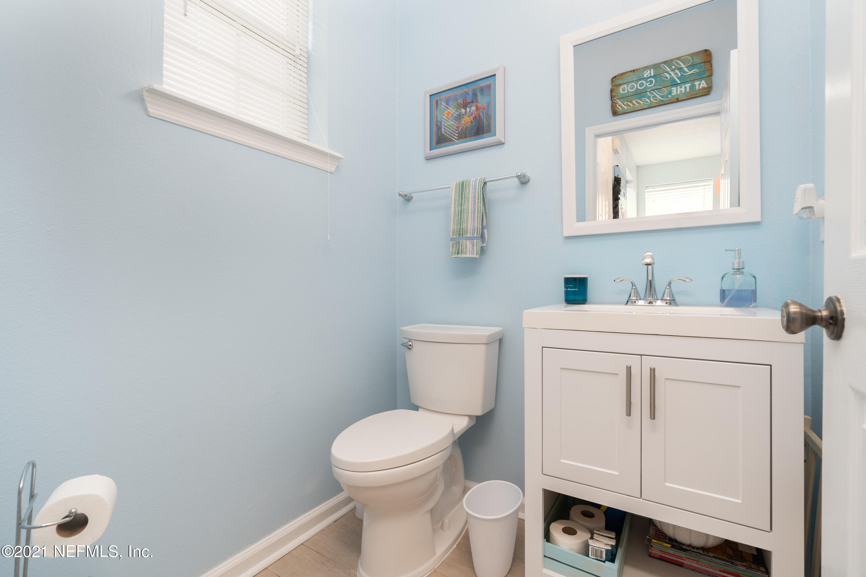 167 Bay Bridge Drive St. Augustine, FL 32080 - Photo 17 of 32 a bathroom with a toilet sink and mirror