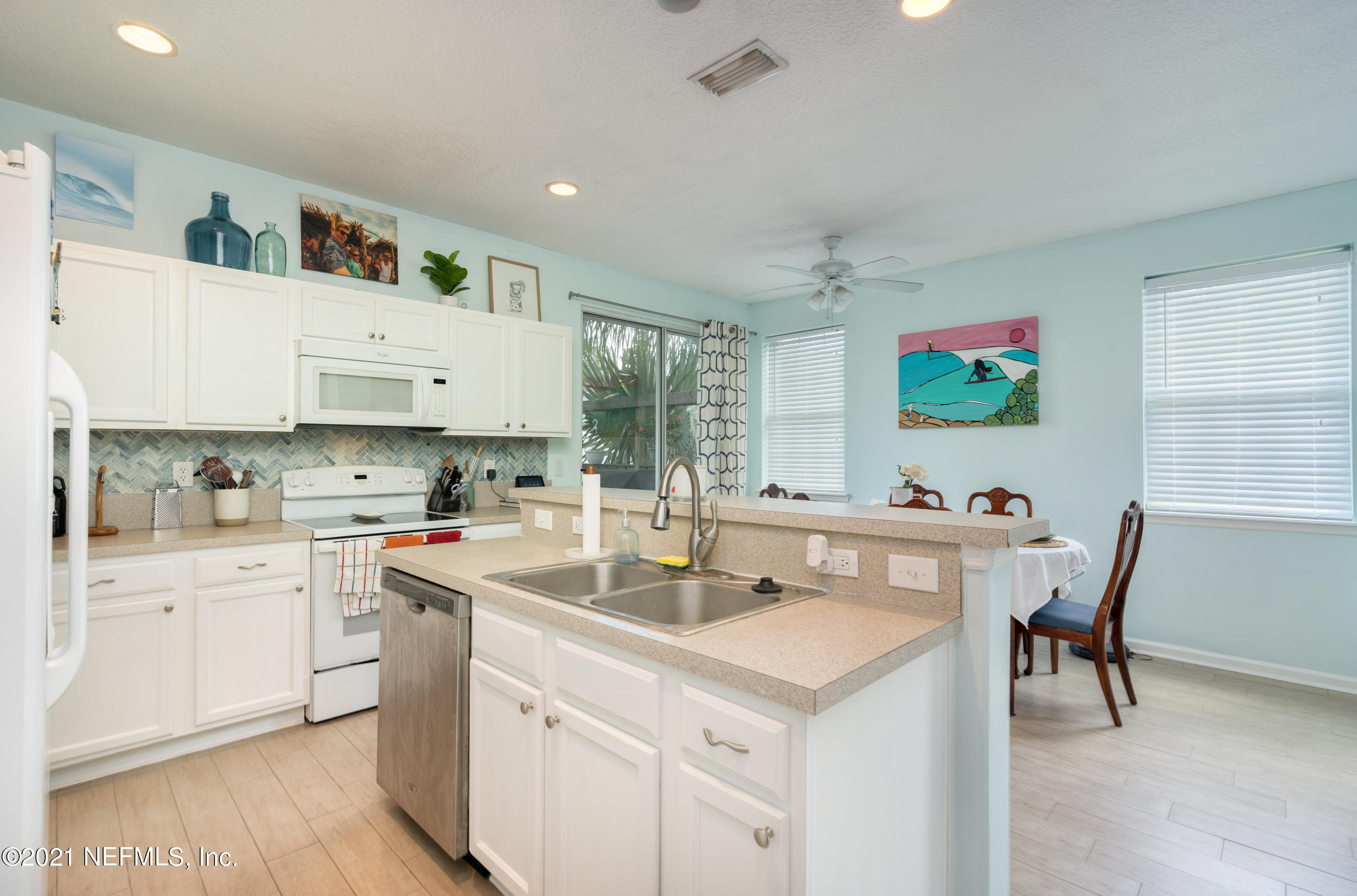 167 Bay Bridge Drive St. Augustine, FL 32080 - Photo 21 of 32 a kitchen with a sink cabinets and wooden floor