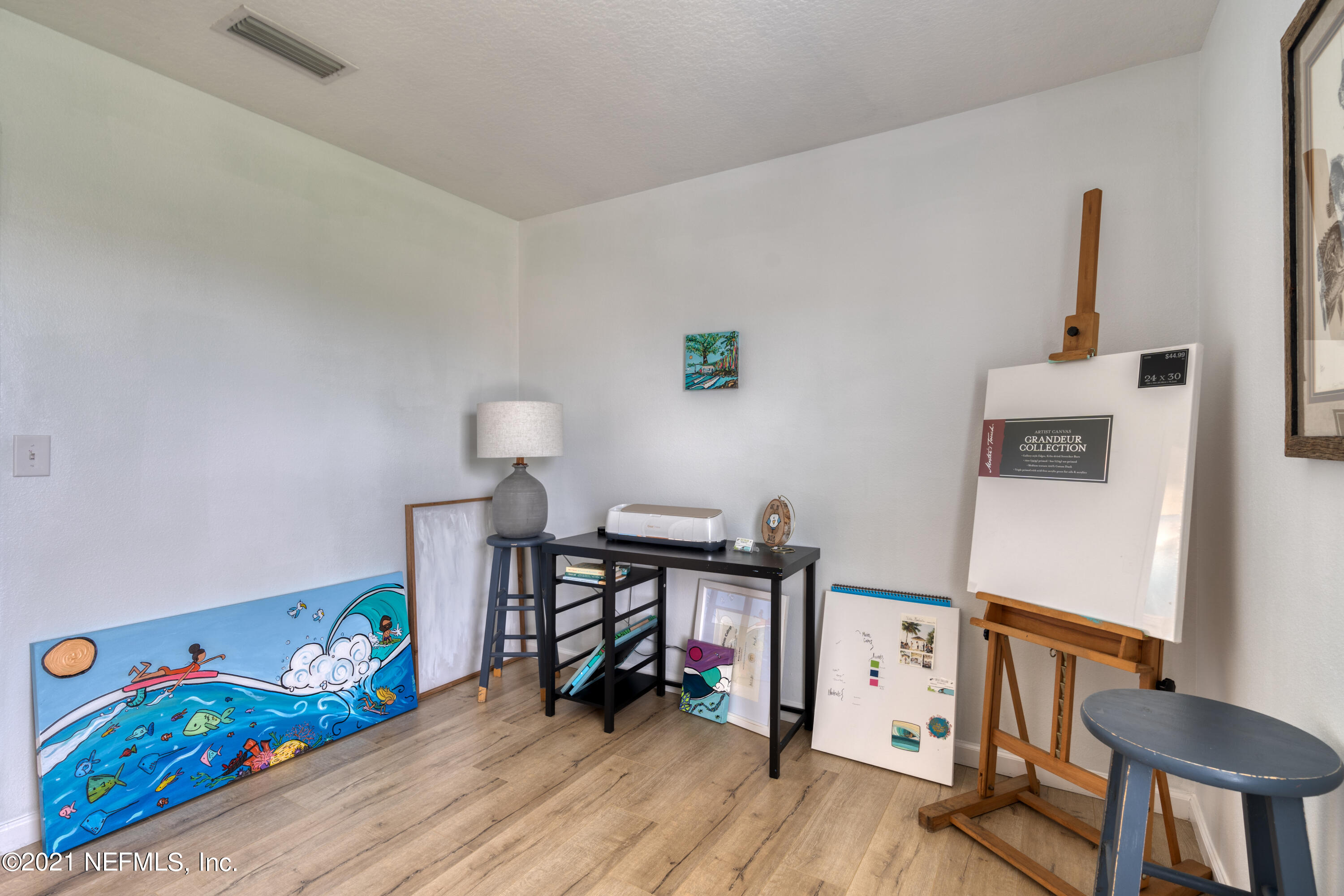 167 Bay Bridge Drive St. Augustine, FL 32080 - Photo 26 of 32 a living room with furniture and a wooden floor