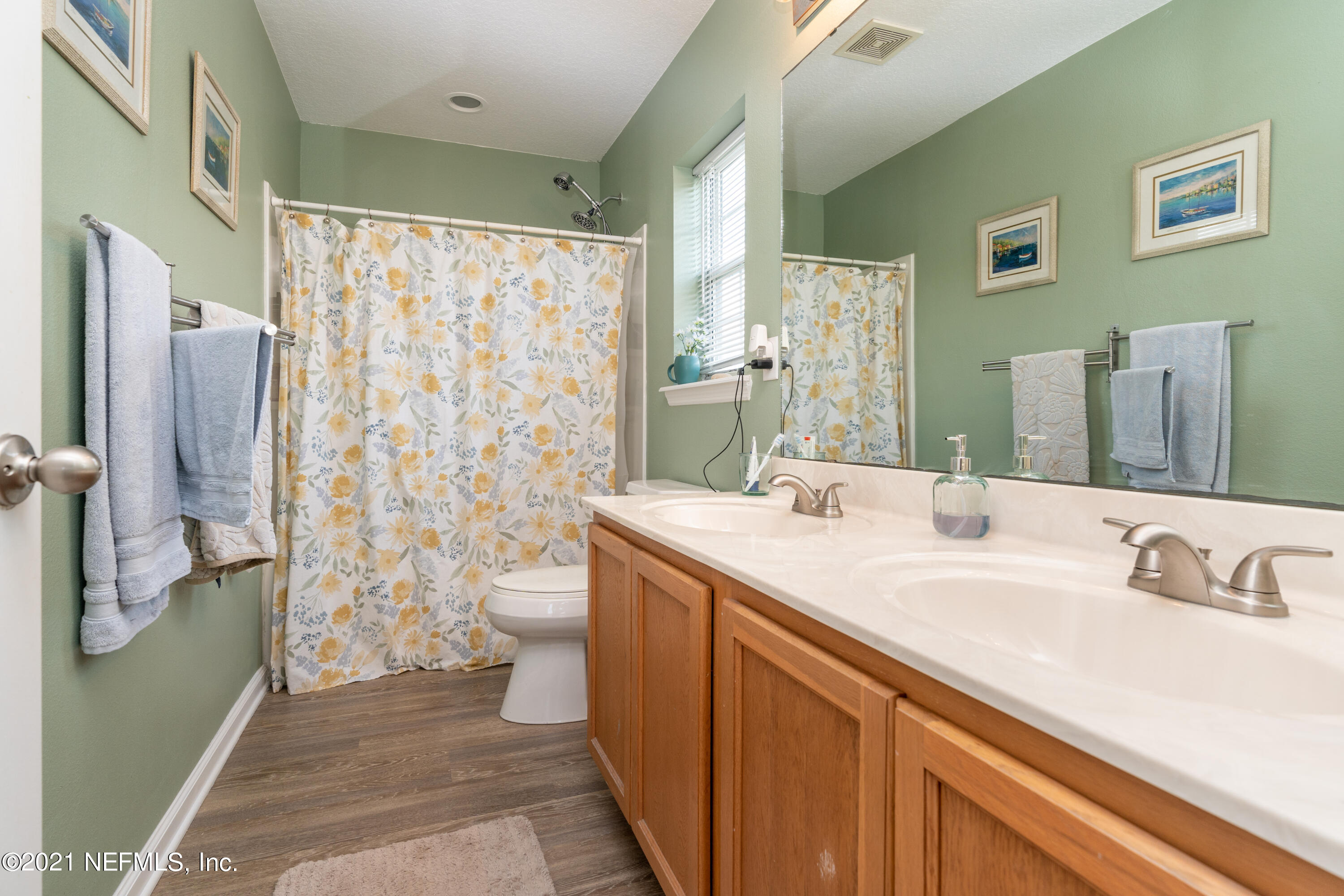 167 Bay Bridge Drive St. Augustine, FL 32080 - Photo 29 of 32 a bathroom with a sink a toilet and shower