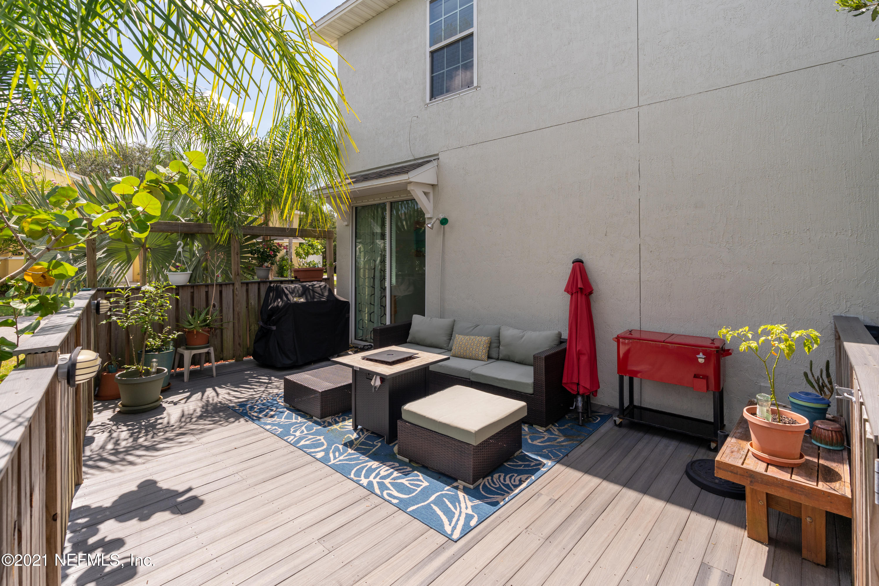 167 Bay Bridge Drive St. Augustine, FL 32080 - Photo 6 of 32 a outdoor space with patio the couches and a dining table with the backyard view