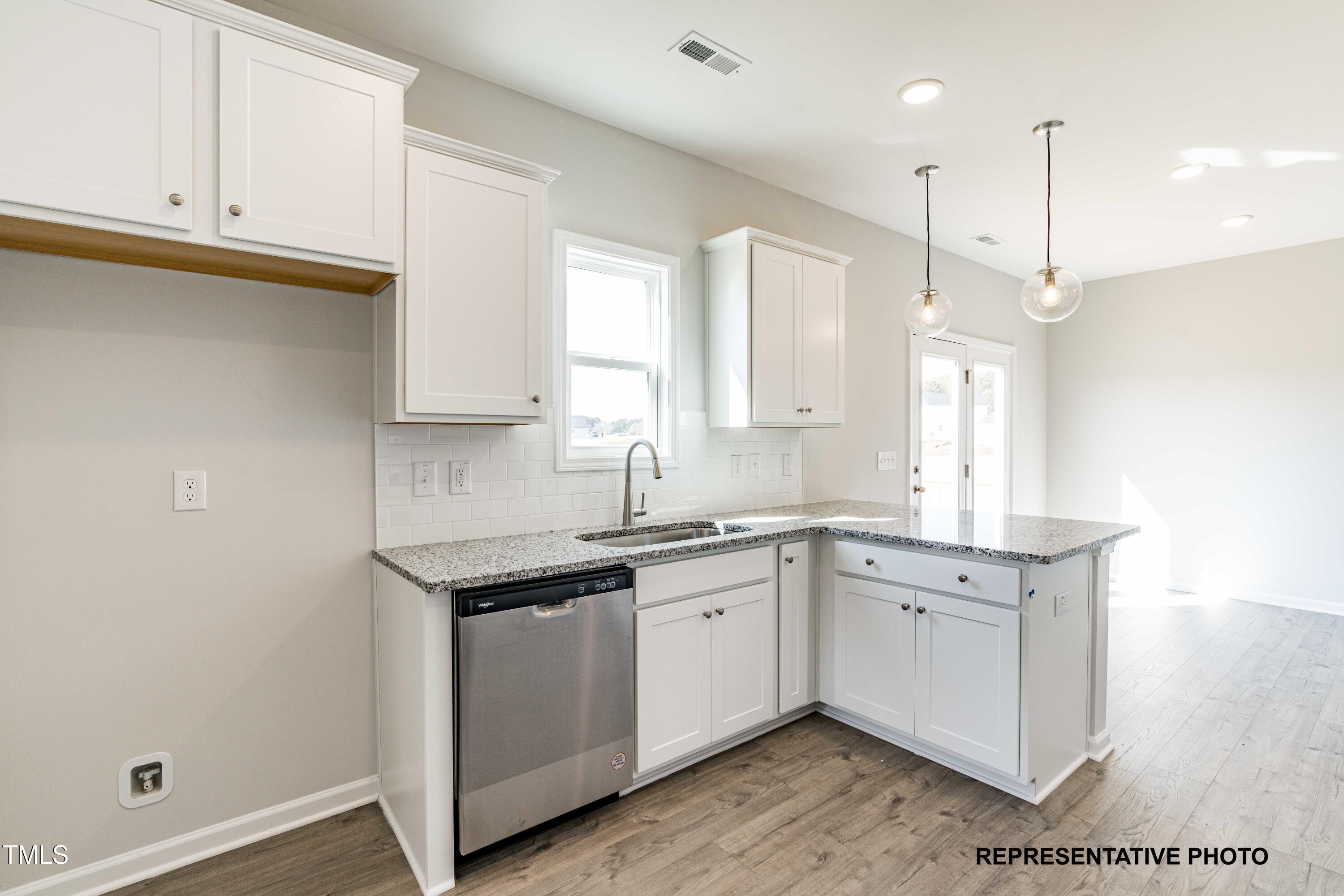 106 Legolas Court Middlesex, NC 27557 - Photo 4 of 11 a kitchen with a sink cabinets and window