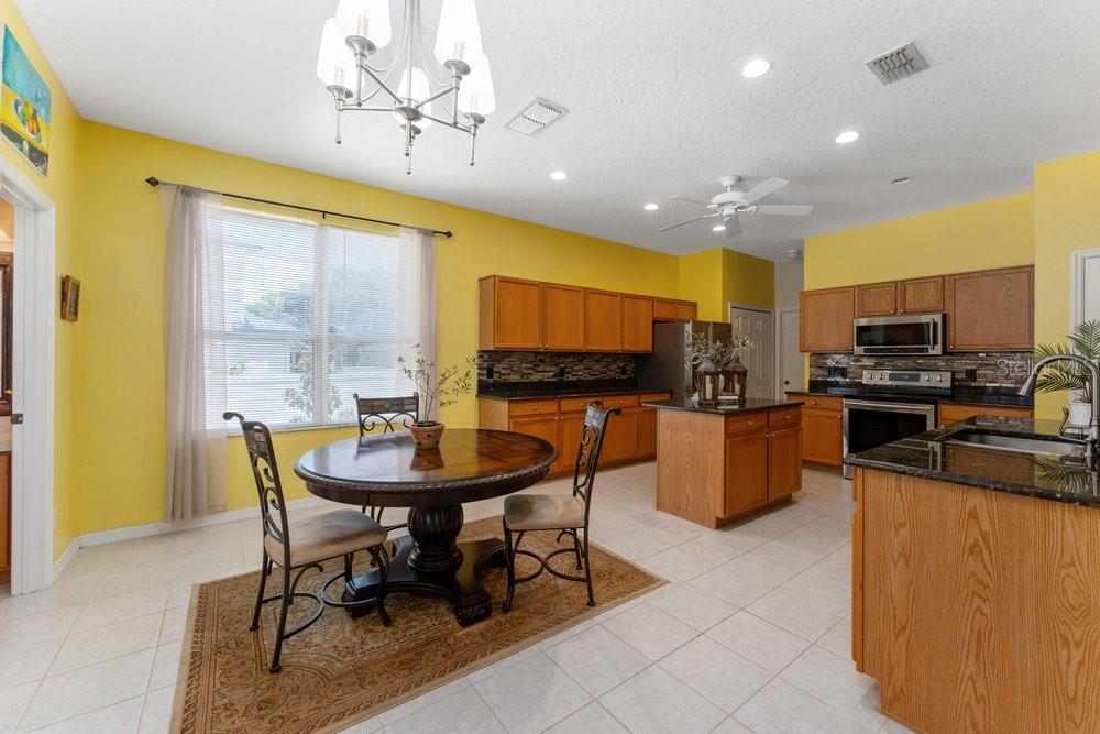 3463 Creek Run Lane Eustis, FL 32736 - Photo 22 of 83 a view of a dining room with furniture
