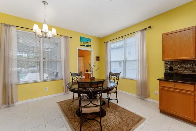 a kitchen with a sink refrigerator and cabinets