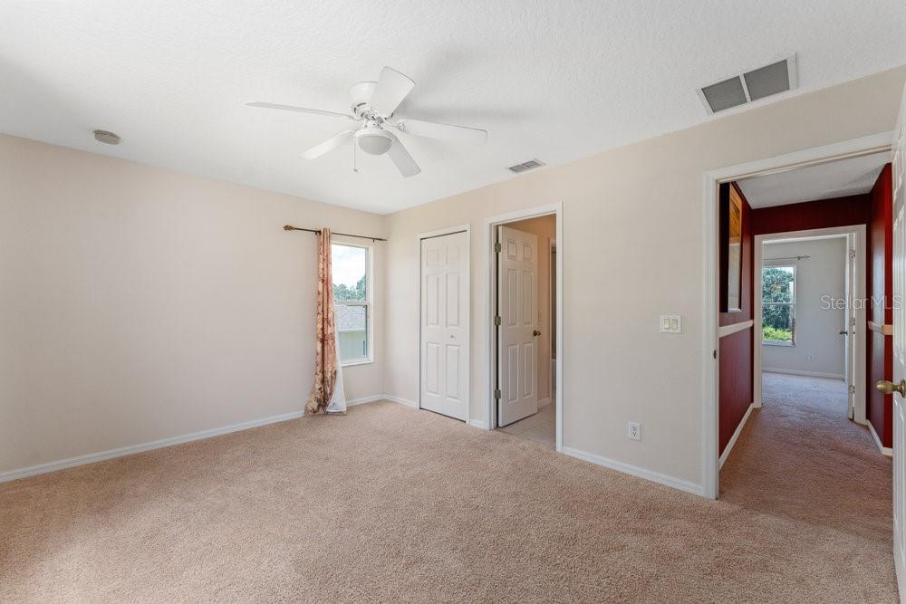 3463 Creek Run Lane Eustis, FL 32736 - Photo 43 of 83 a view of an empty room with a fan