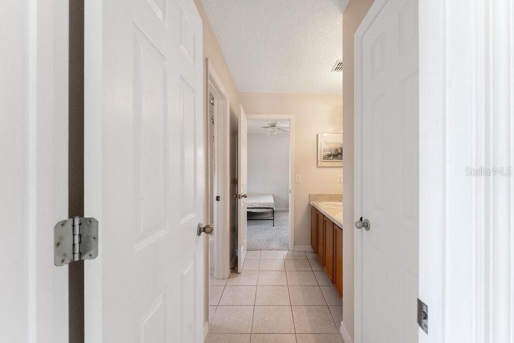 3463 Creek Run Lane Eustis, FL 32736 - Photo 44 of 83 a bathroom with a sink and a mirror