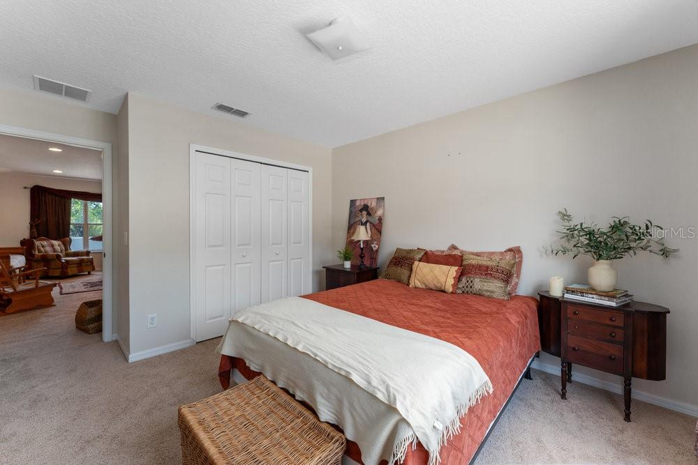 3463 Creek Run Lane Eustis, FL 32736 - Photo 51 of 83 a bedroom with a bed and a couch