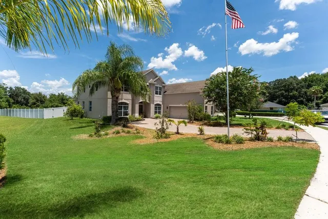 a view of a house with a yard porch and sitting area