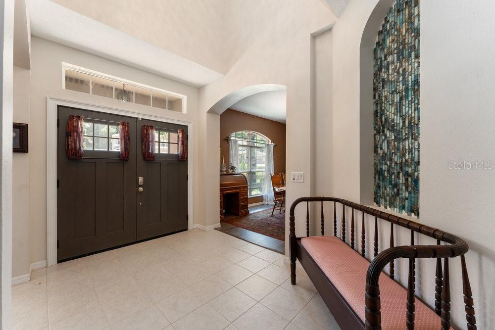 3463 Creek Run Lane Eustis, FL 32736 - Photo 9 of 83 a view of a hallway with windows and stairs
