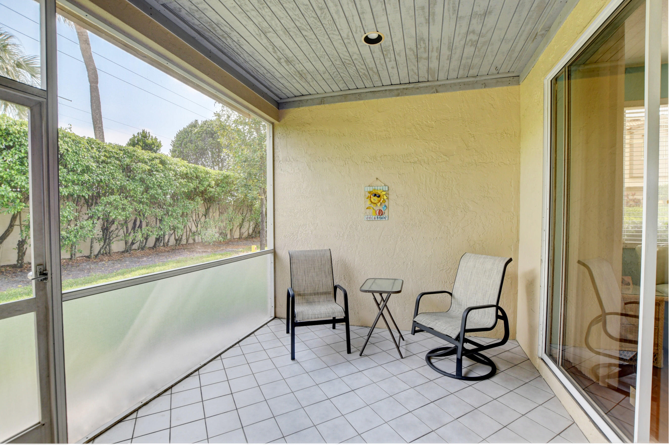 6746 Via Regina Boca Raton, FL 33433 - Photo 23 of 25 a view of a chairs and window in the room
