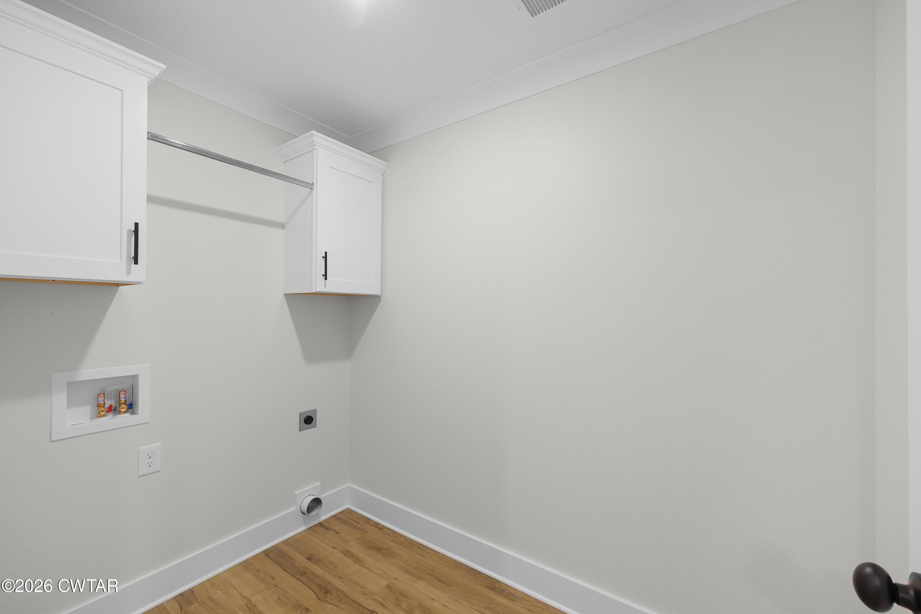 17 Easington Cove Jackson, TN 38305 - Photo 13 of 19 a view of a room with wooden floor and cabinets