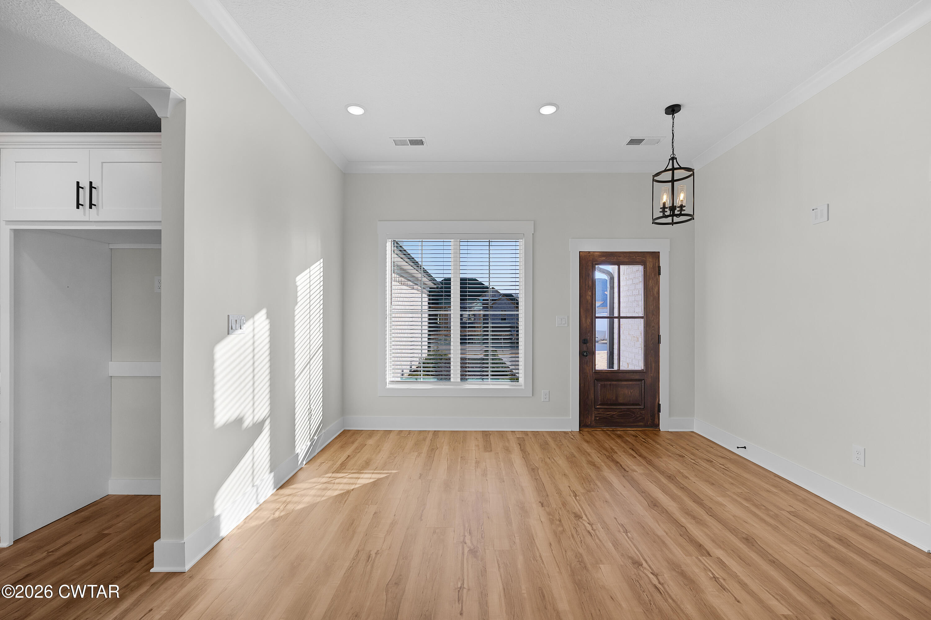 17 Easington Cove Jackson, TN 38305 - Photo 3 of 19 a view of an empty room with wooden floor and a window