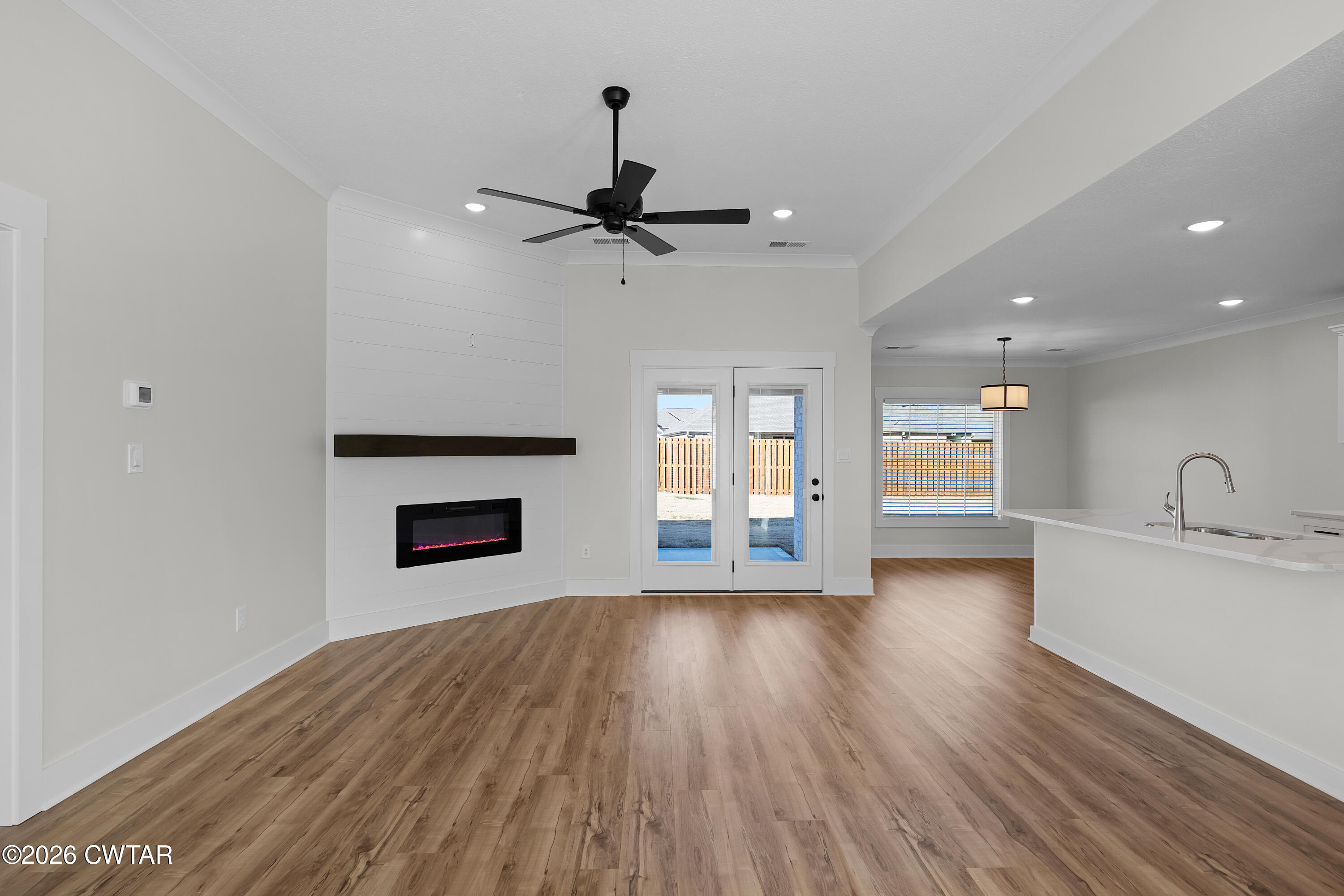 17 Easington Cove Jackson, TN 38305 - Photo 5 of 19 a view of empty room with wooden floor and fan