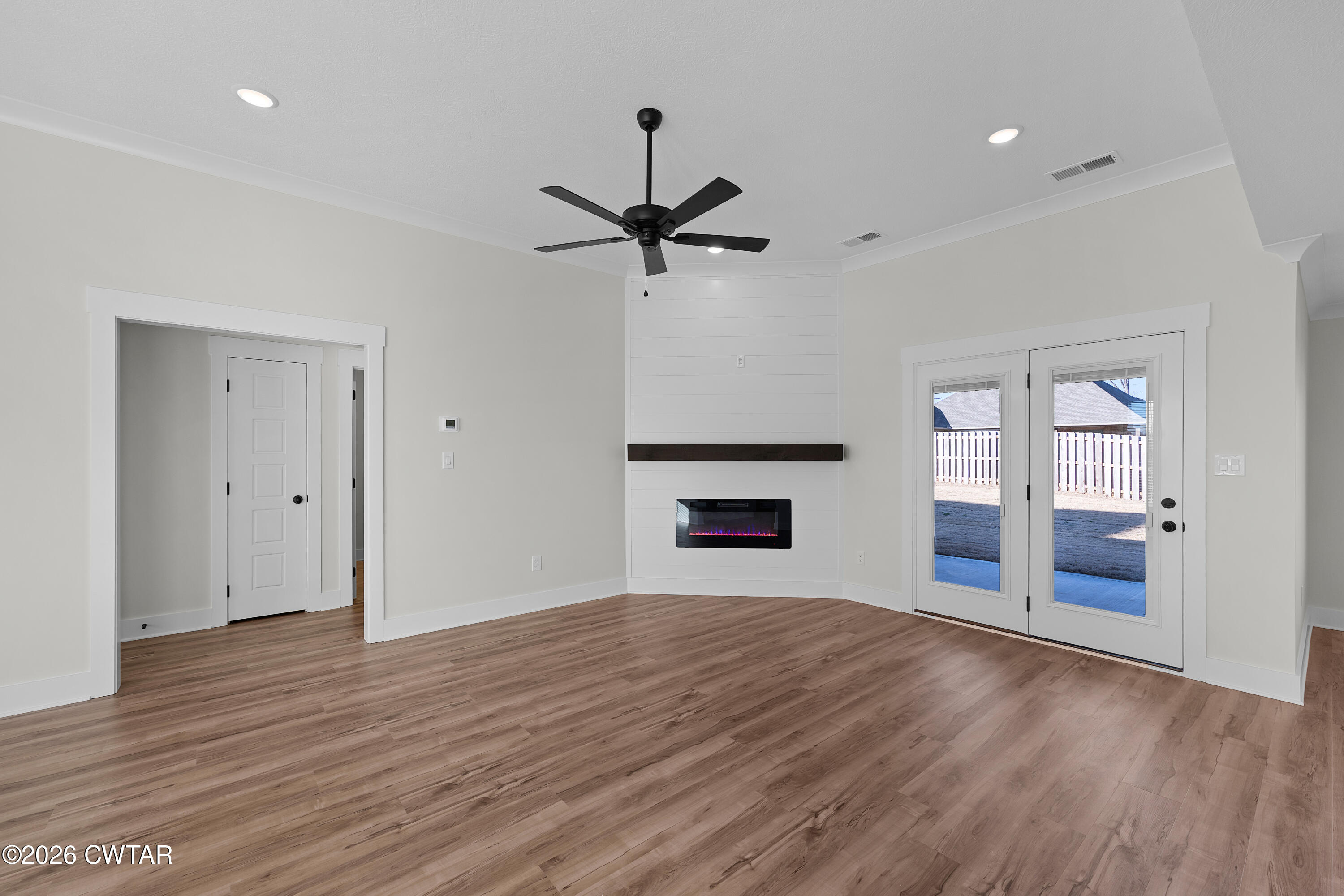 17 Easington Cove Jackson, TN 38305 - Photo 6 of 19 a view of an empty room with window and wooden floor