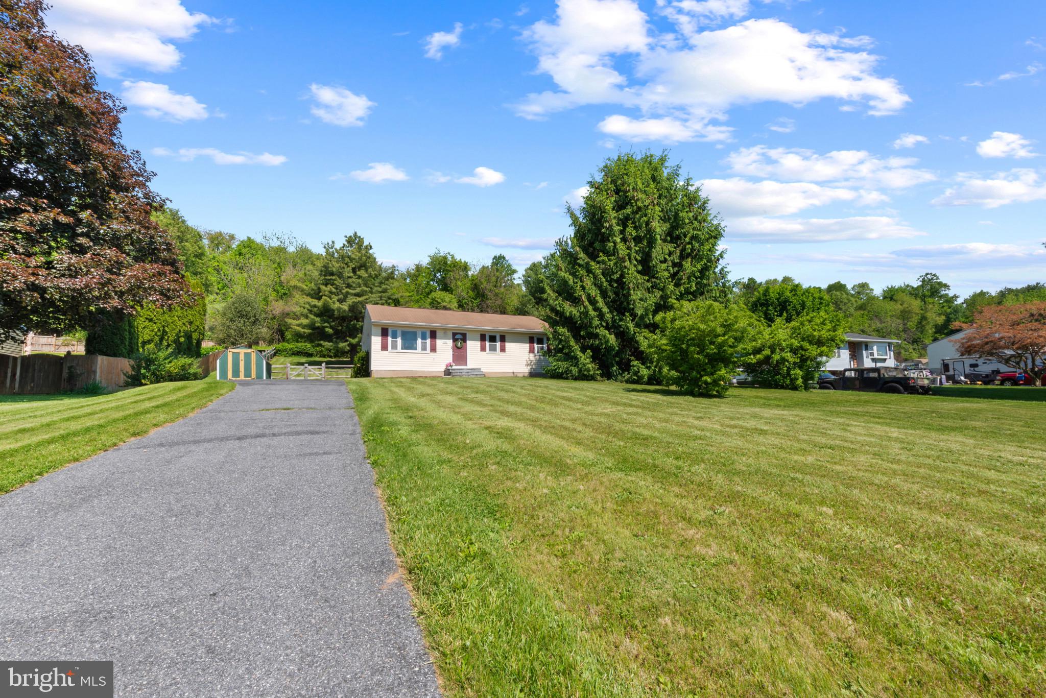 3242 Lineboro Road Manchester, MD 21102 - Photo 1 of 30 a front view of a house with a yard and trees