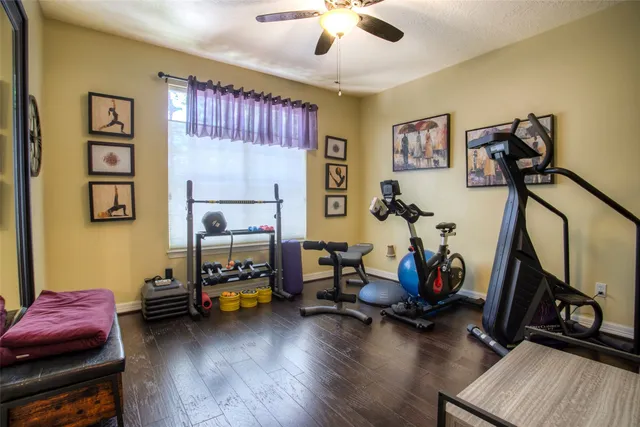 a bedroom with furniture and a wooden floor