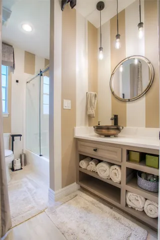 a bathroom with a sink double vanity and a mirror