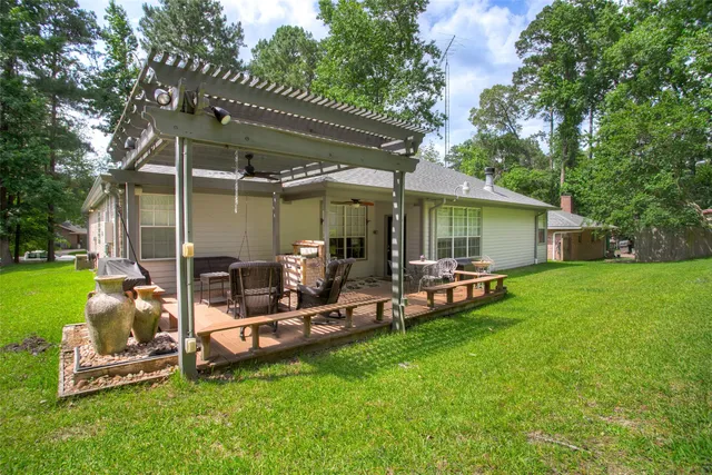 a view of a backyard with sitting area