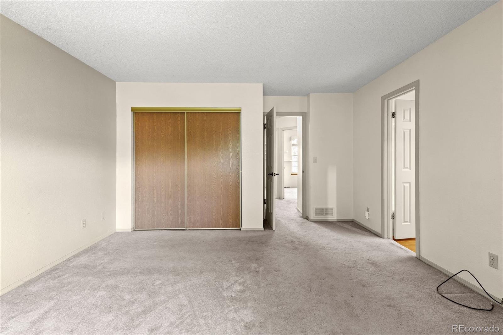 8536 Union Circle Arvada, CO 80005 - Photo 18 of 26 a view of an empty room and a closet